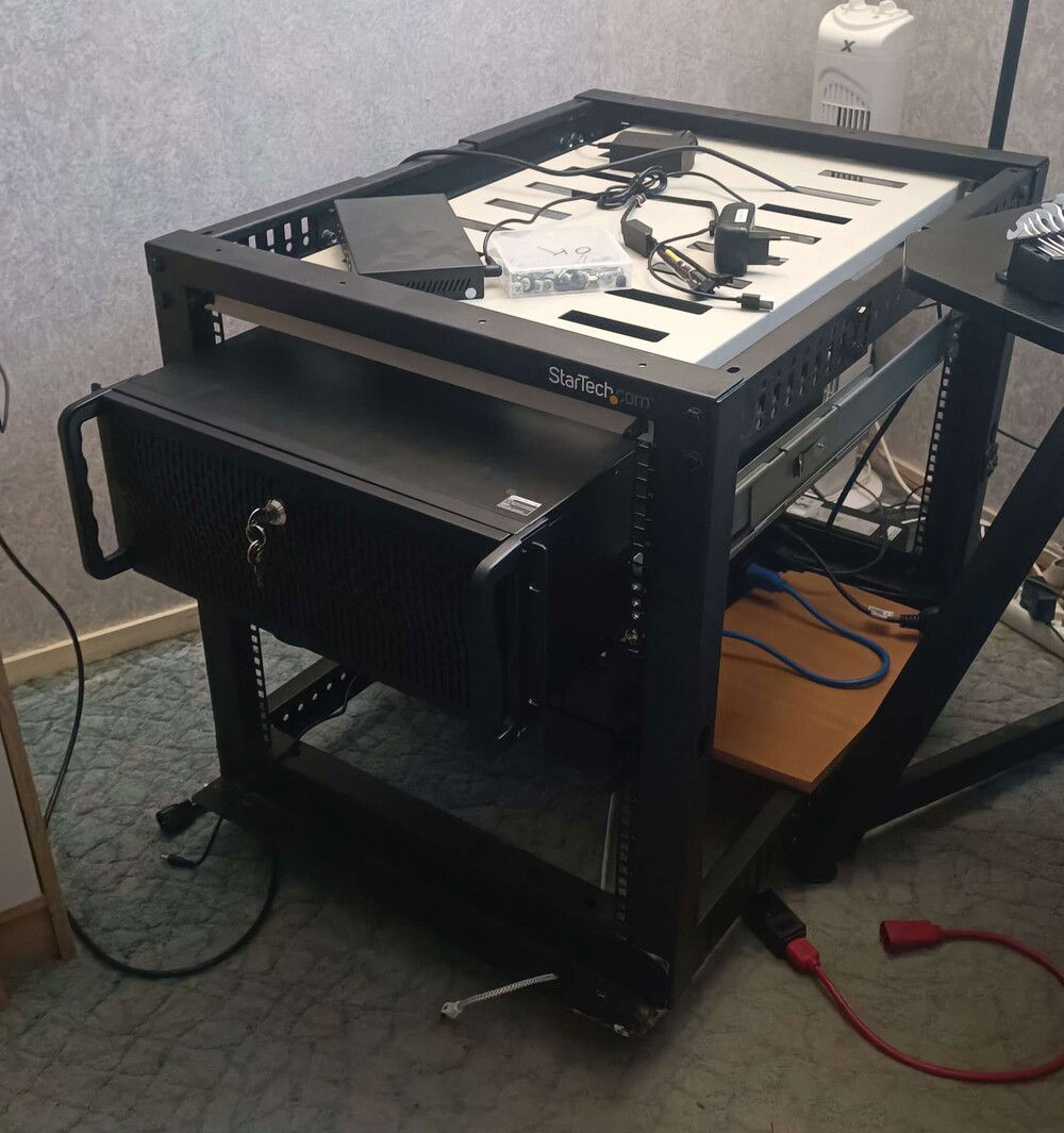 then thanks to a few "dumpster dives", I managed to snag for myself a server shelf and slide rails for the server (as well as a couple of cable passthrough panels that are unnecessary for now :) )