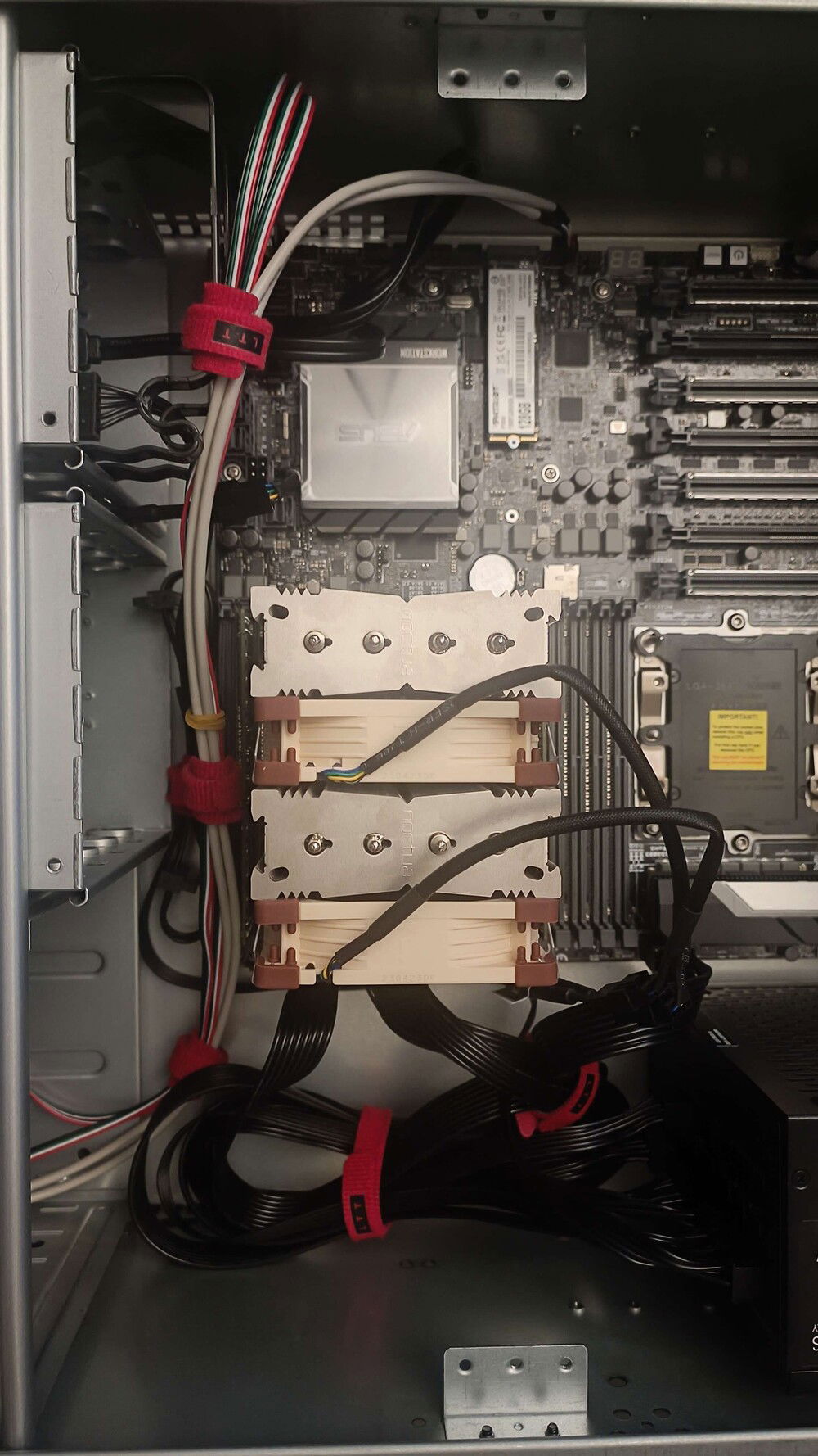 Fans pushing air from the big empty space into the power cables
Likely uncommon and/or unorthodox BUT you can observe from the previous post that the front fans of the case are within the drive bays and that the space on the right does not have a fan (considering to jerry rig a mount for a third fan with cable ties or go all the way and 3D print one)