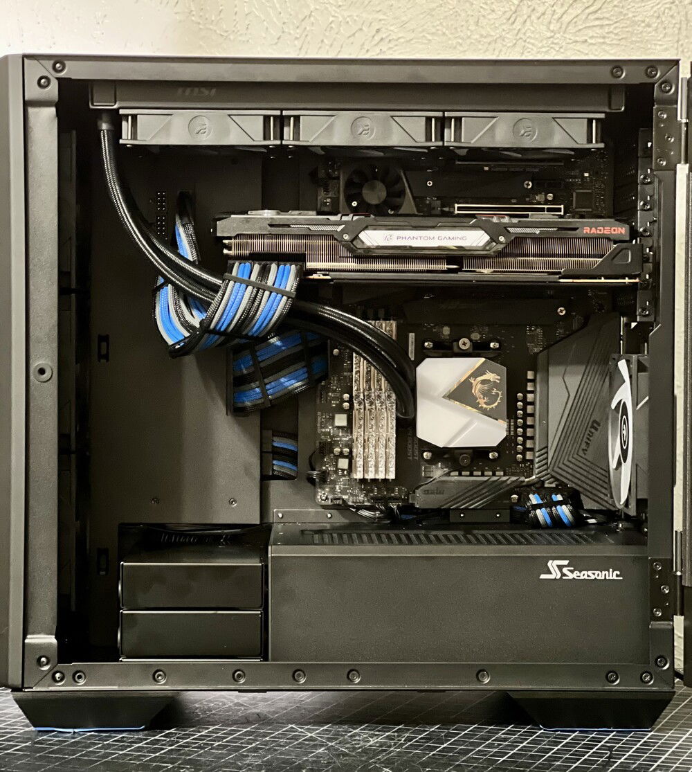 The "Radeon" logo and RGB panel on the GPU, as well as the AIO pump cover, were upside down. Modding them wasn't too difficult, although I did have to tear down the GPU fan shroud.