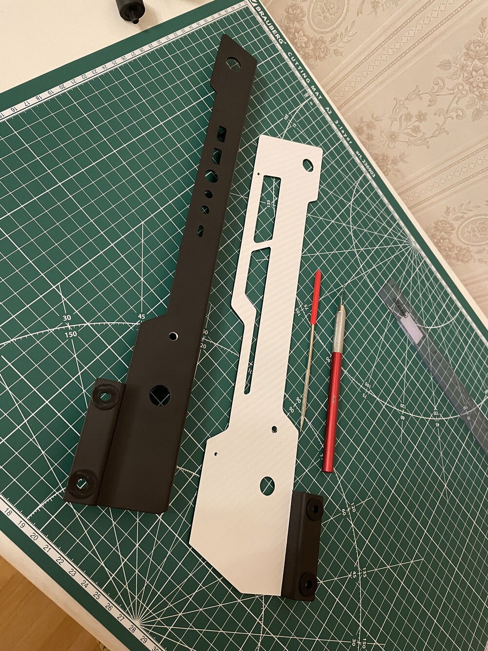 Wrapping parts in vinyl film.