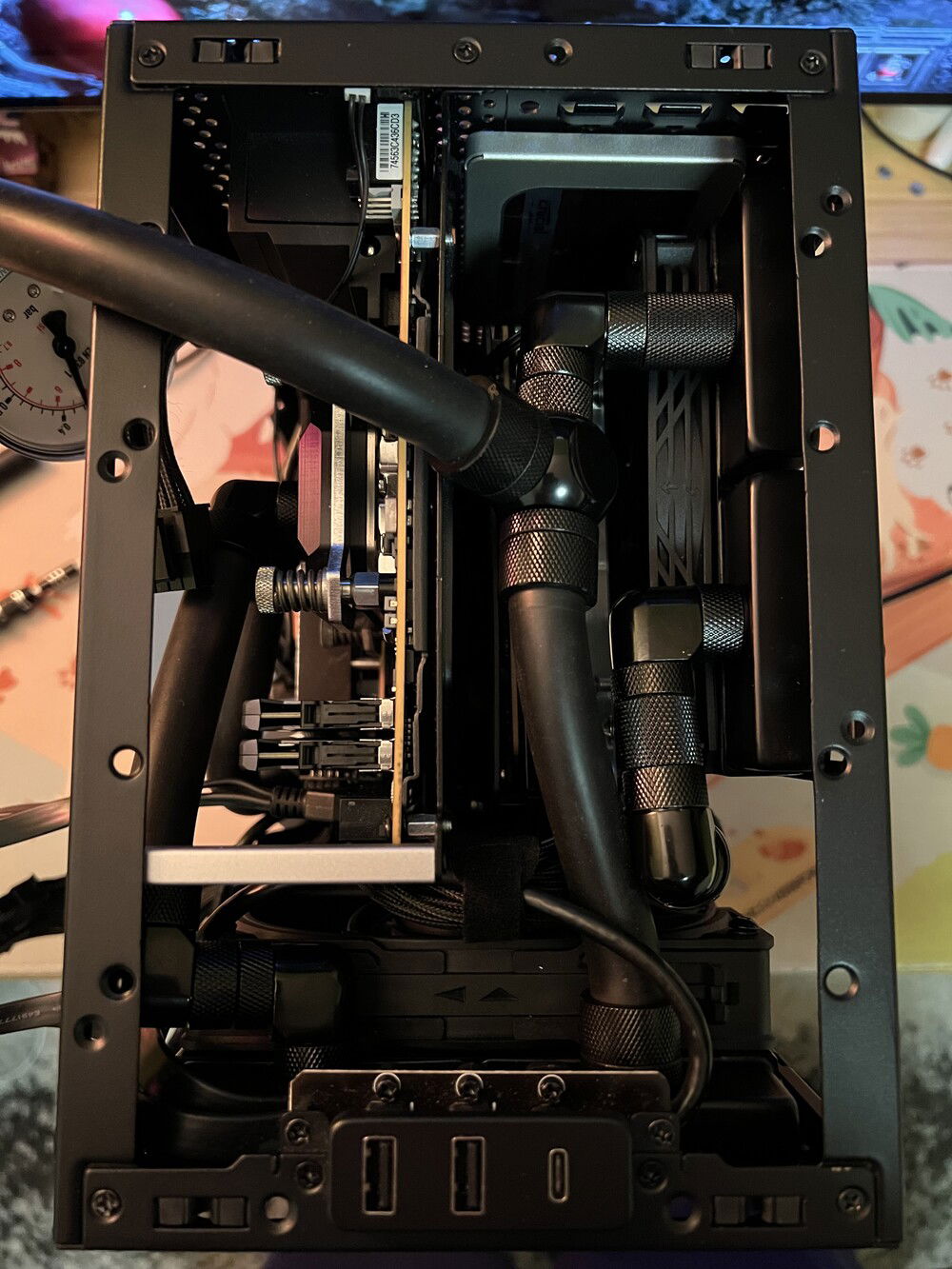 Tubing route at the top of the case, underneath the exhaust fan.