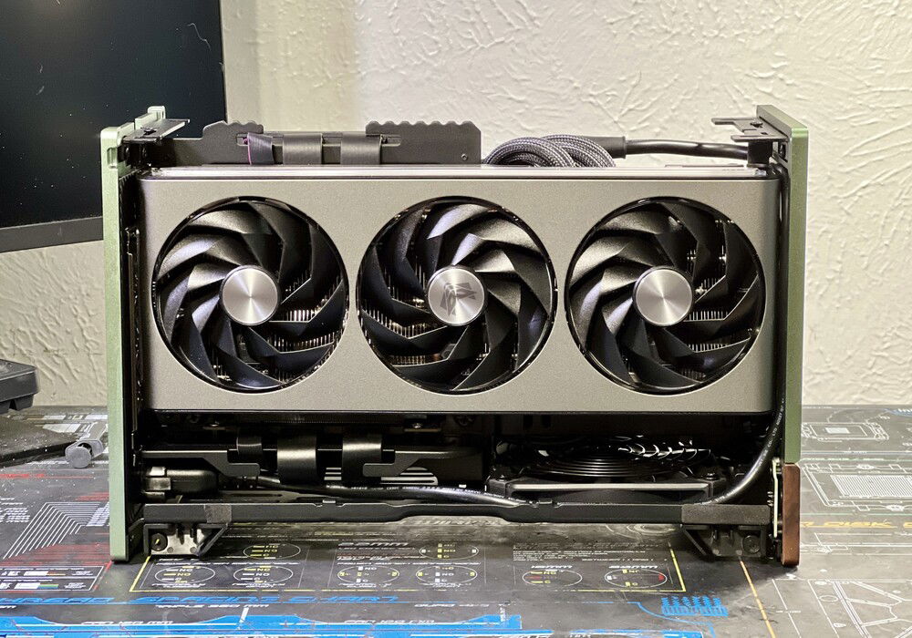 ...but it just barely fit. Had o remove the end panel from the case to install it. Not really visible, but I started out with a Corsair AF120 Slim in the bottom, but it was also noisy as hell,, so went back to a Noctua 120 slim.