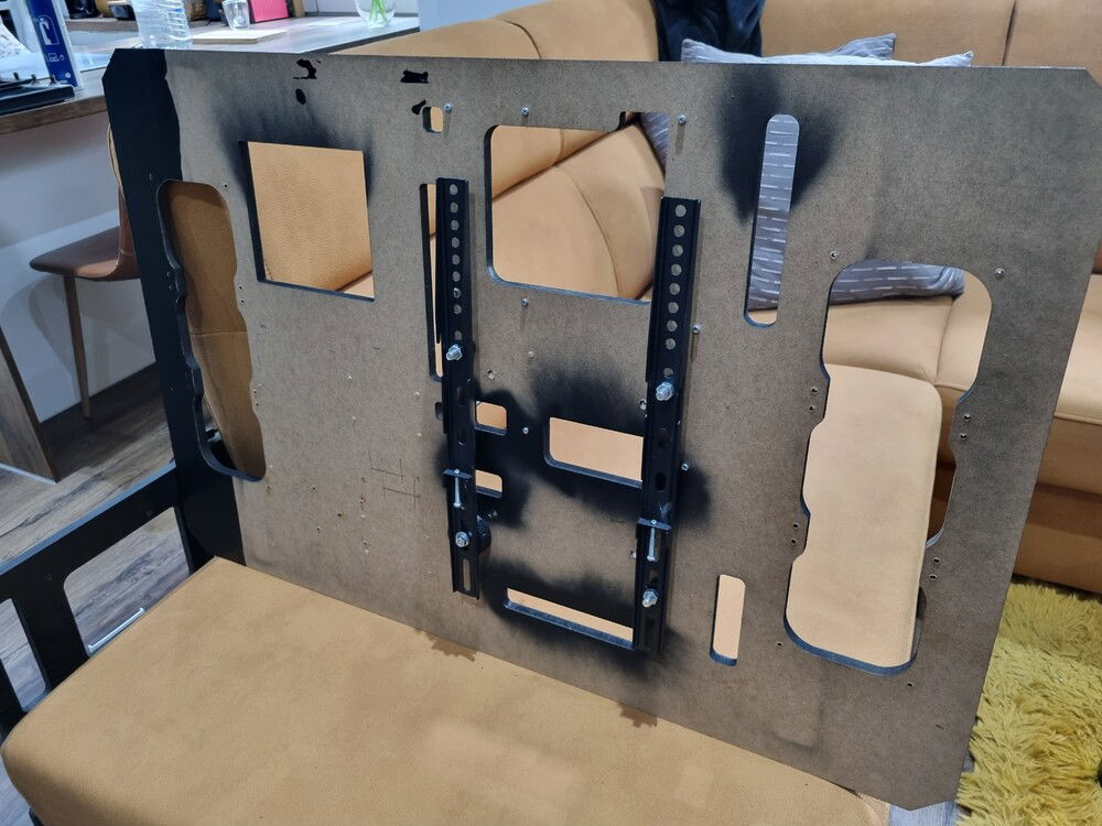 TV VESA adaptor to hold it on wall with arms to be able to reach in the back