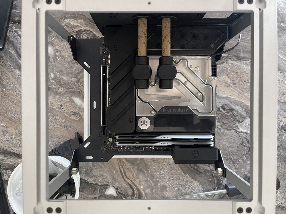 Test fitting the motherboard into the case for clearances