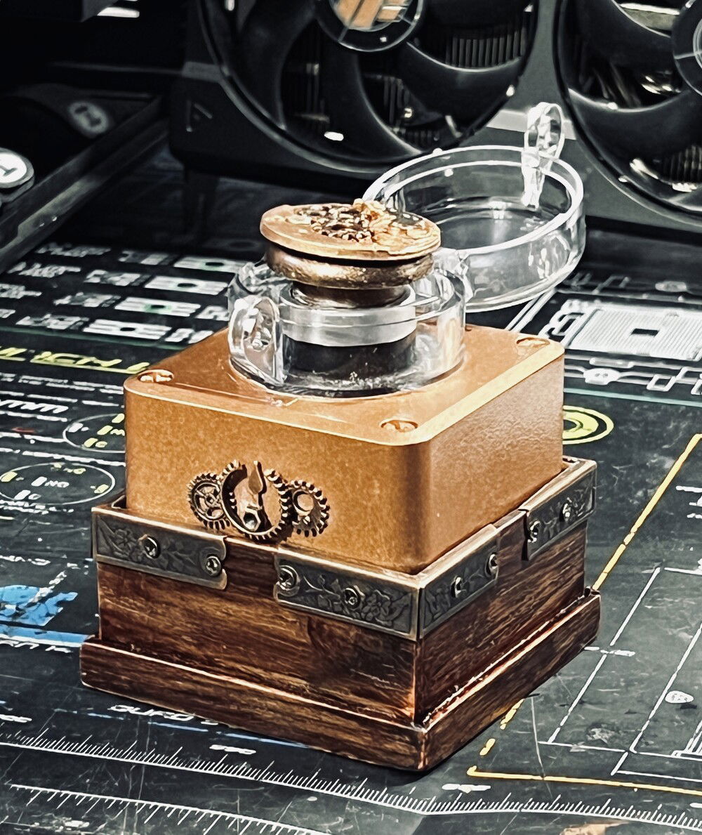 This is a remote start switch for the PC, connects via BT to a PCI card behind the GPU. It started off as just a yellow and black box with a red button.