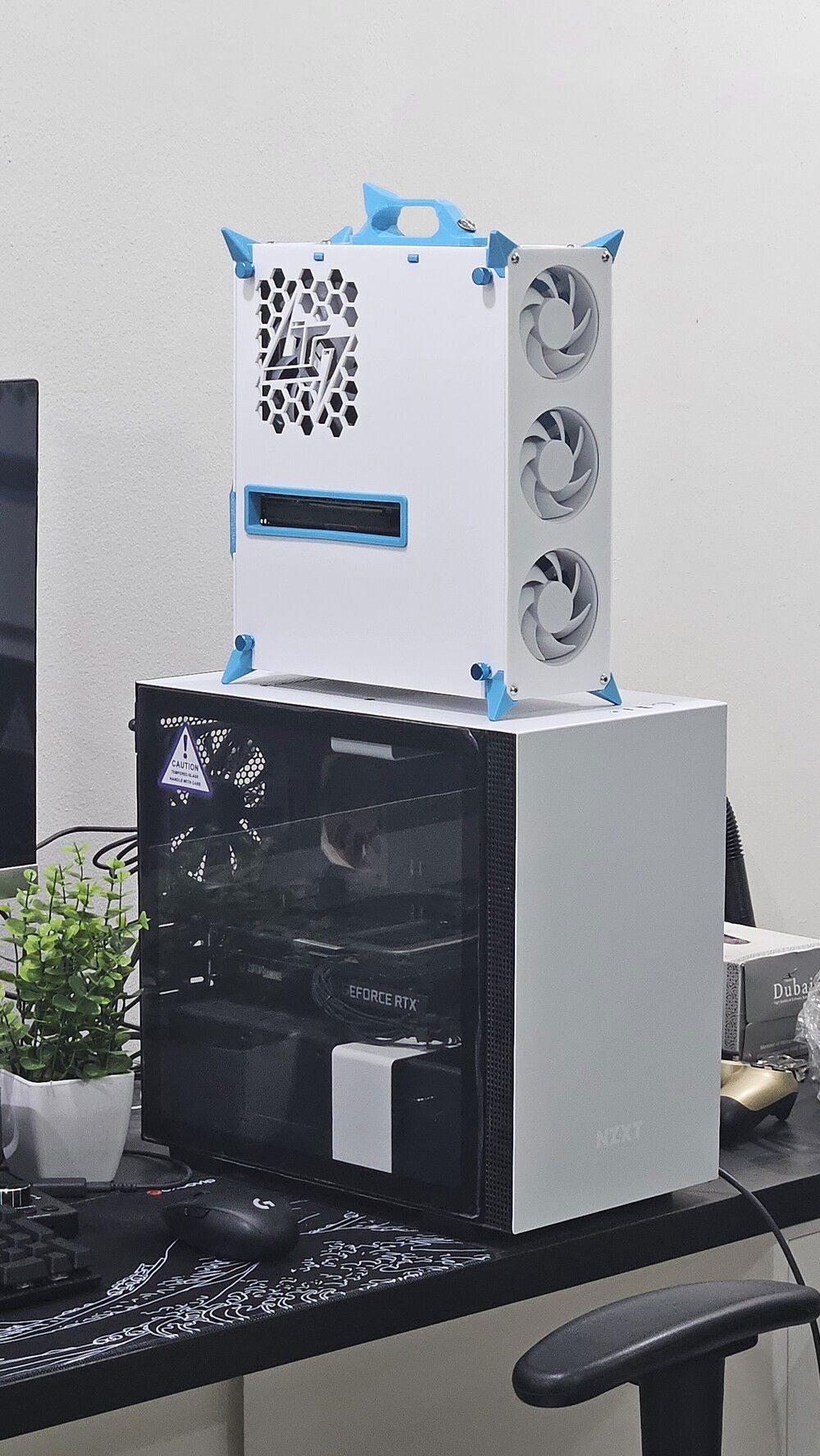 Brq Zero sitting on top a "Mini-ITX" nzxt h100