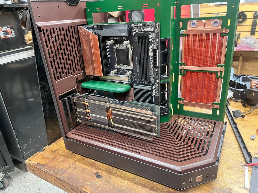 Frustrated, I decided to look at the GPU fitting. The case only allows a vertical mounting option, well one has do do slight mod to mount it horizontally.  I painted the grate on the floor and the cable attachment. Then I tried to mount the copper radiator and see how this looked.