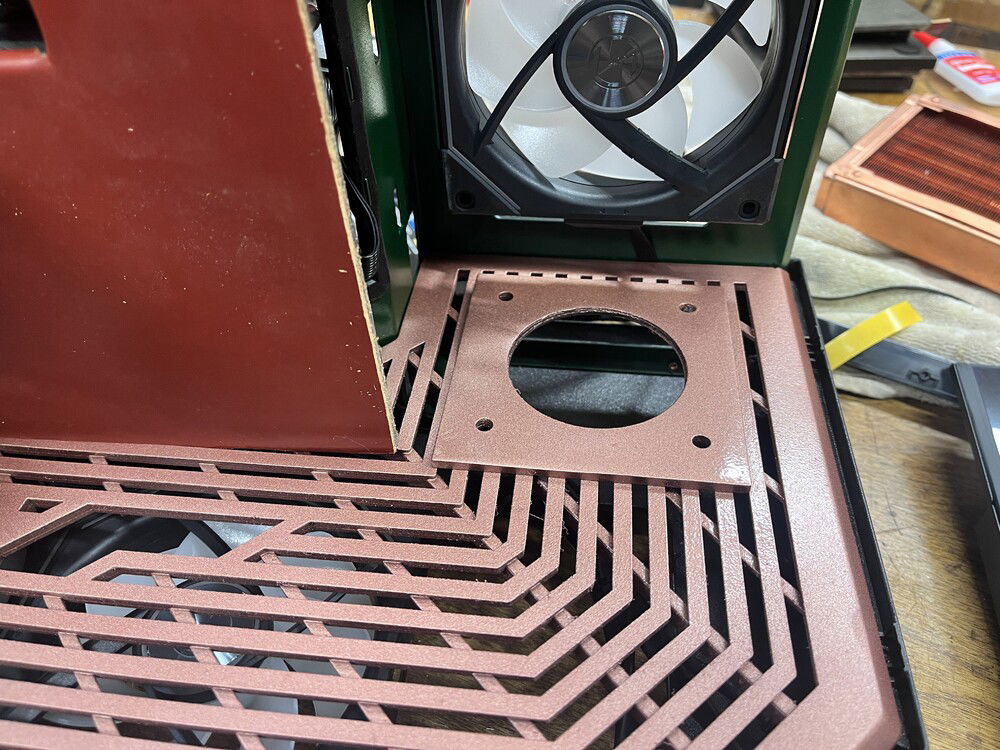 The hole looks kind of like a bogg.  Anyway, I made the commitment and chopped a hole into the grate and hoped I had measured it correctly,. Close enough for government work. It was reinforced so that the tank would not lean like the tower of Pisa.  Again that pesky physics.