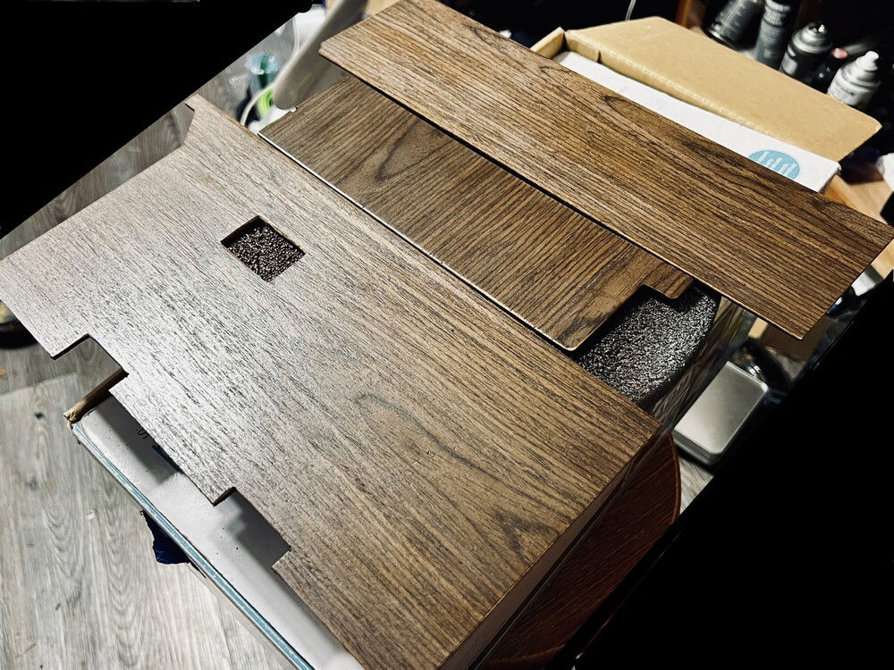 Cut-outs in the panels match the cable passthroughs in the case. They're lightly stained and a few layers of clearcoat.