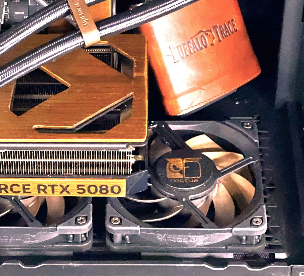 I always cover the label on the rear of the fans when visible. I went through several designs, but settled on a modded version of Noctua's owl logo.