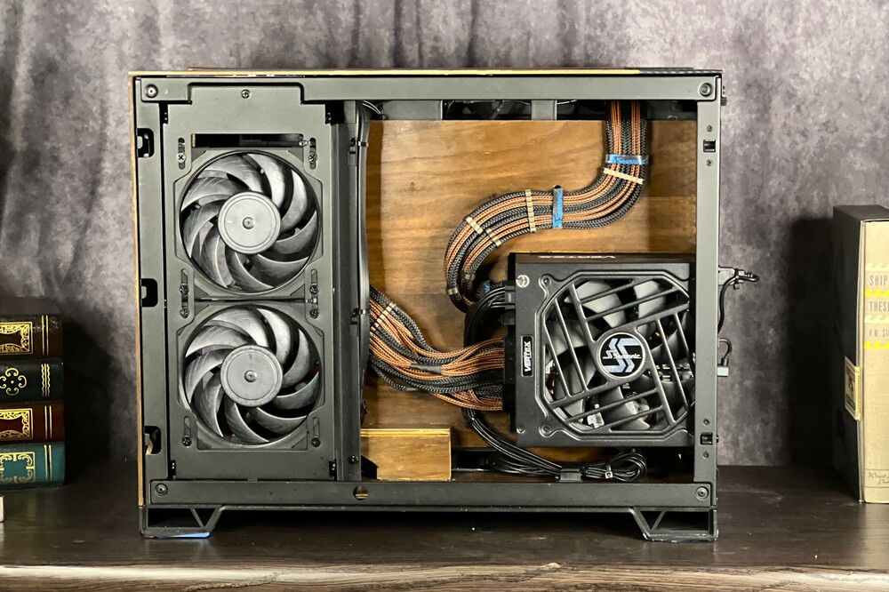 Obsessive cable management is a part of all my builds. Some wiring is hidden behind the wood panel, and it gave me a way to secure the CPU cables. With the custom cables and shortening all the wires there wasn't a lot of clutter to begin with; no RGB fans helped as well.