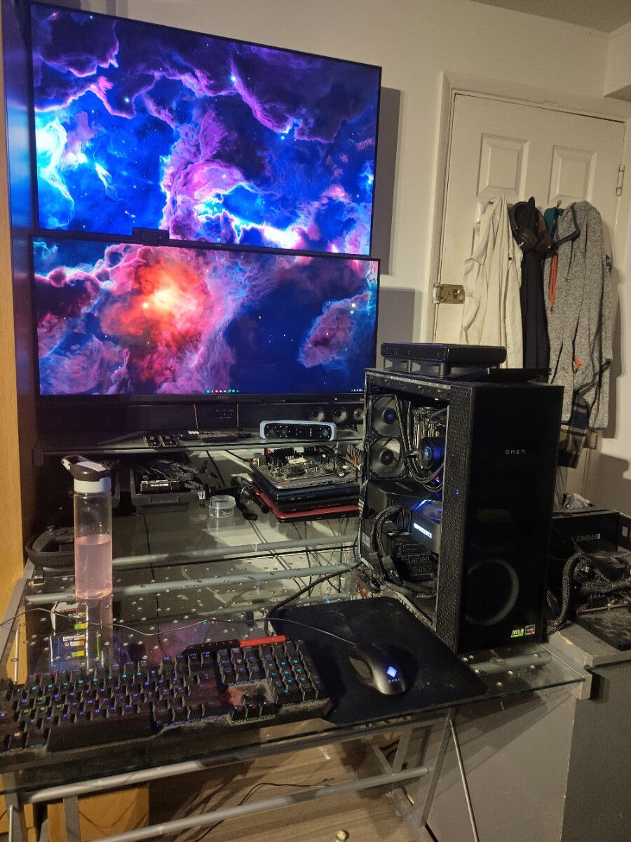 The current build and setup. Windows 11 Pro for Workstation, Wallpaper Engine, TranslucentTB. Mixed use for gaming, CAD and 3D scanning.

The overall look isn't as striking as before. Some RGB is lost due to incompatibility, some deliberately left disconnected for a stealthier look.