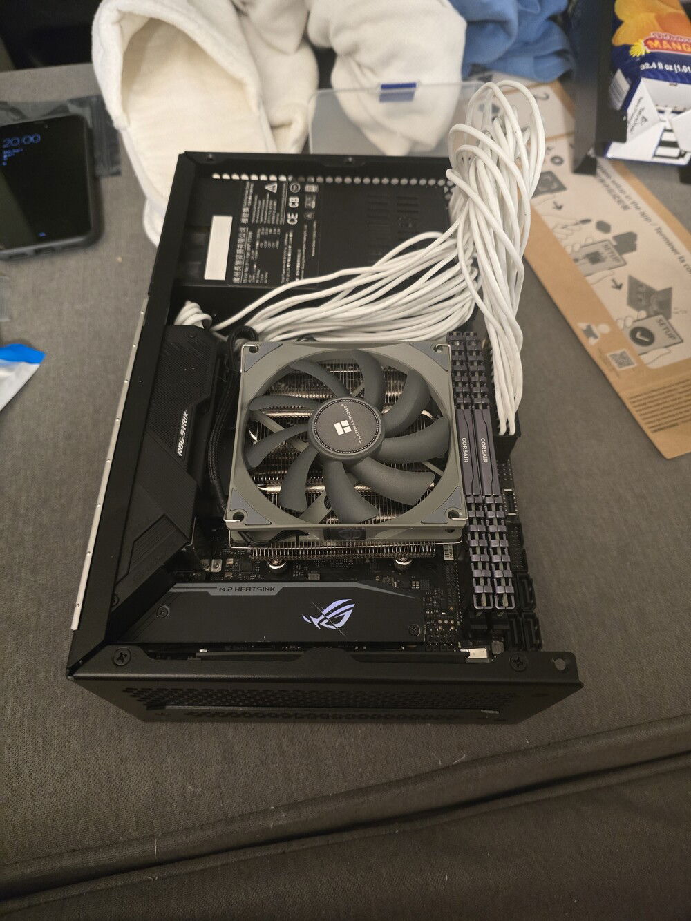 Mobo with all the things installed, put in it's place in the case. Aforementioned CPU fan, before I glued nylon washers into it.