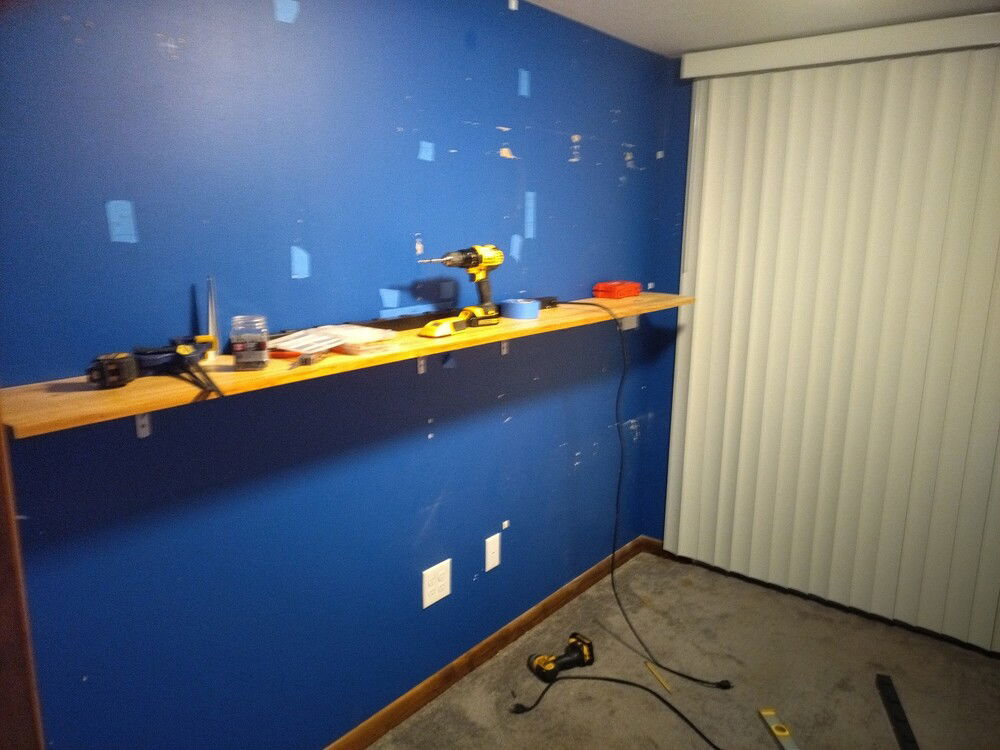 Shelf is hung and prepping the wall