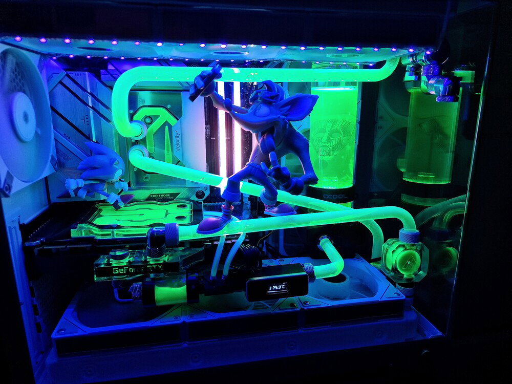 Experimentation with tubing + UV-reactive green coolant (night mode).
