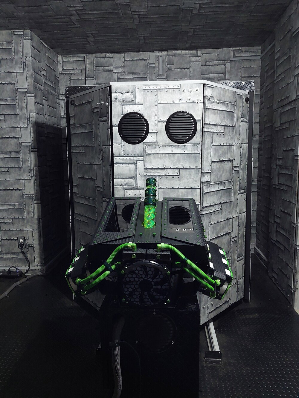 Sitting on its "engine block" outside of the simpod.