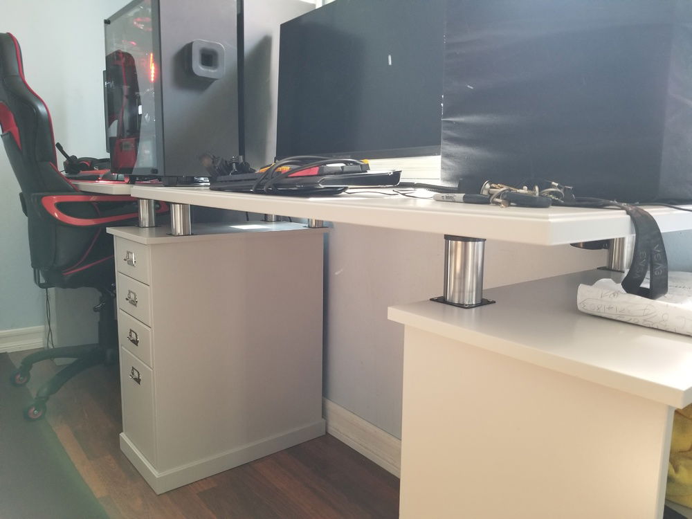 got some legs. since my chair wont go in, bought some rollerblades wheels for the chair. SMOOTH AS BUTTER. and only PC is built and running.