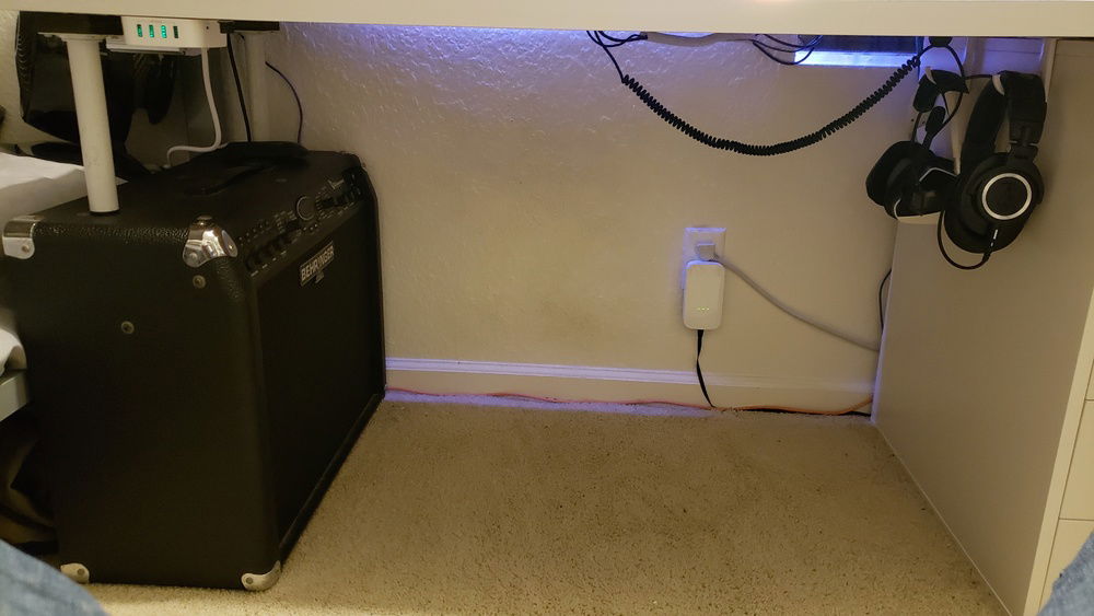Probably the peak of my cable management. On the ground, there's ethernet, powerline, and power.