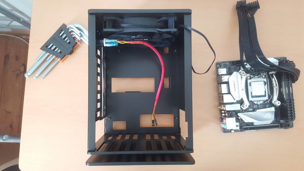 Here is the full aluminium case chassis, with the be quiet! fan pre-installed. The motherboard side I/O side was slightly bent/deformed which was annoying, but not a big deal when everything is fitted in. I had to rush out and buy a set of ball tip hex screwdrivers since I was not warned about hex screws before the purchase. Ball tip drivers are vital since there are many awkward screw holes.