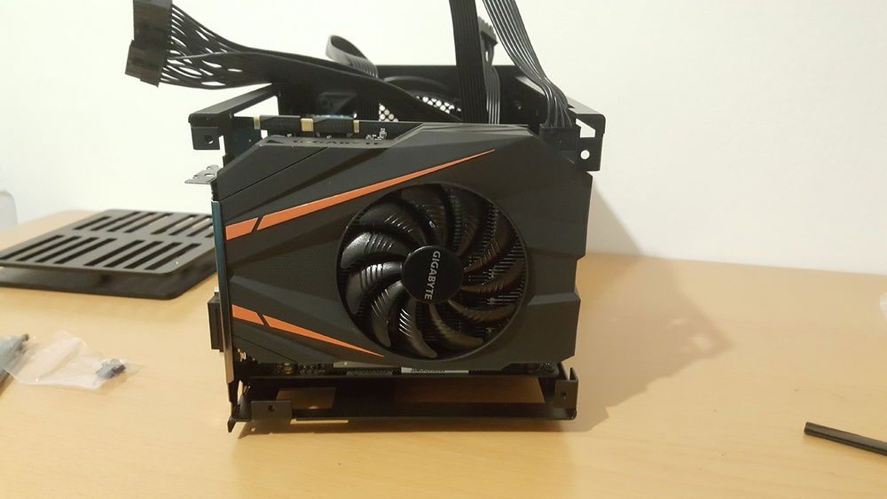 Bottom of the case had to be taken off to install the GPU. And those 4 little bastard screws involved in the process will ruin your day.