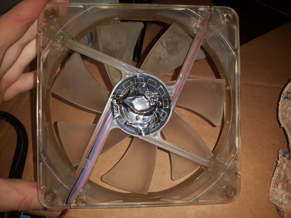 Cleaning the PSU fan, very sticky from my ex smoking indoors in my old apartment.