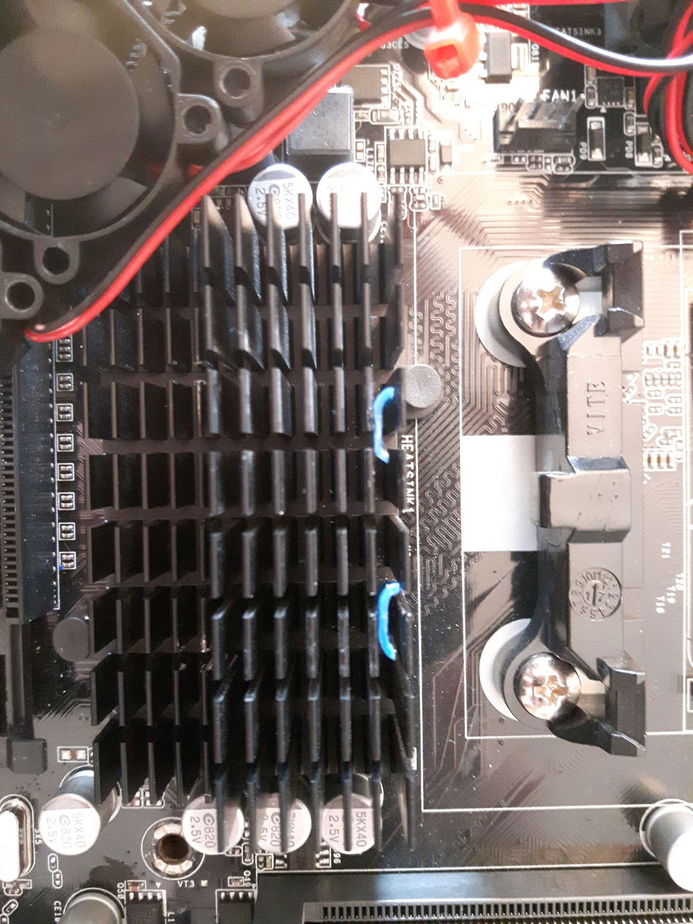 Superglued them to the heat sink. This took tweezers and patience, i dropped them in several times before getting them to stick.