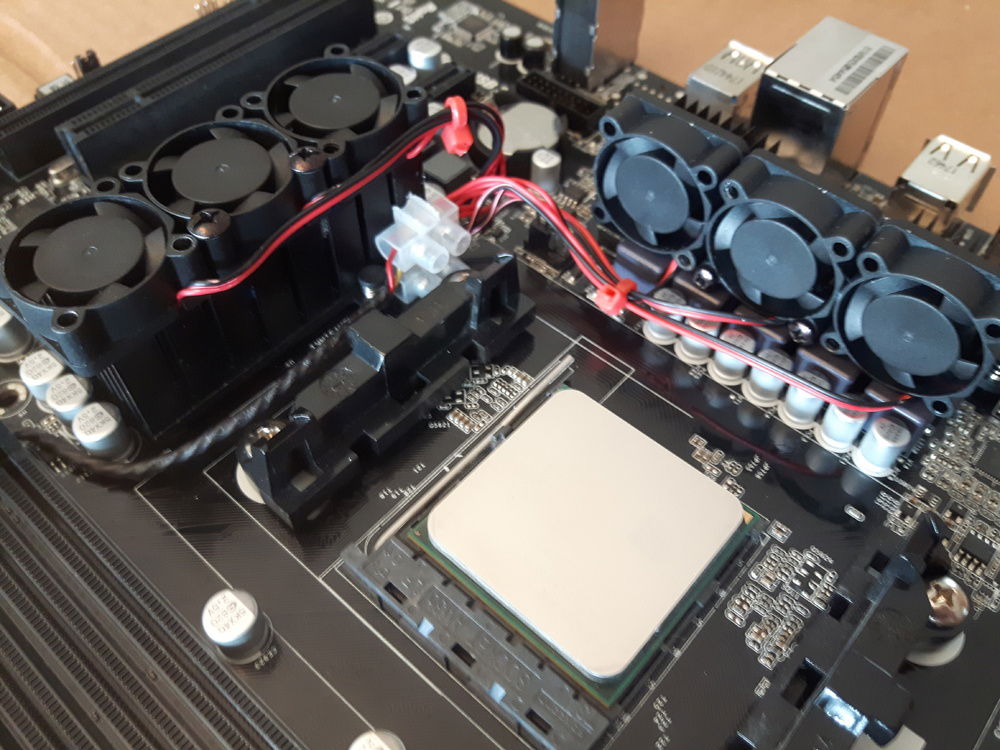 Fans attached to the motherboard, before i revised their positioning the next day.