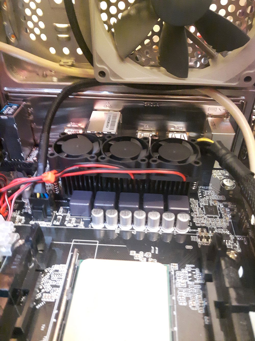 The next day i moved the VRM fans to point down to cool the chokes and capacitors as well as the heatsink.