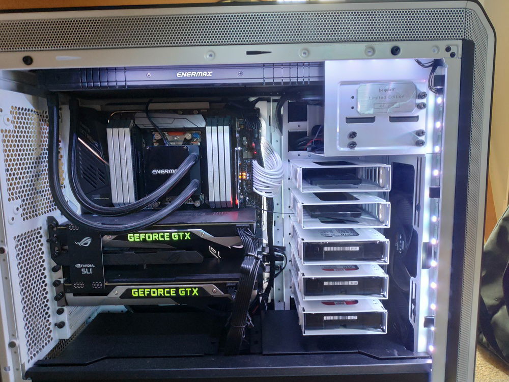 Facing the motherboard side. Here you get a good glimpse of the drive layout, cooler, Chassis badge and pretty much everything else you need to know. The PSU and a drive are hidden by the Be Quiet PSU shroud.