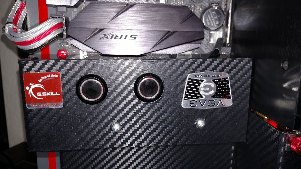 Power on the right.  The fan toggle on the left.  Custom cable sleeving (The first build where I didn't do it myself; it's so time-consuming that was well worth the money to go commercial)