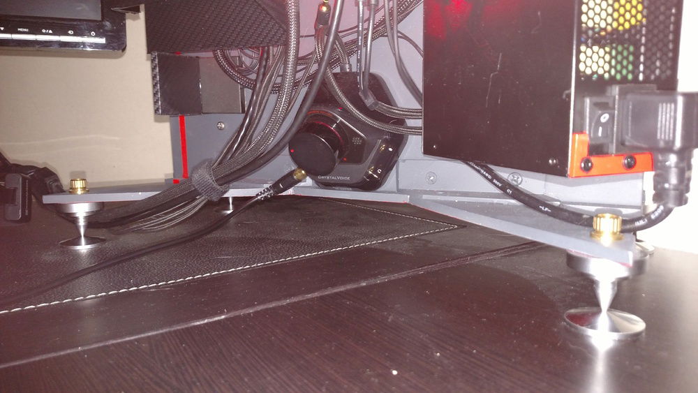 Bottom view.  Build in volume control, and a whole lot of power out of a little SFX power supply which is rated to 800W.  Under peak load, I draw 675 on my current overclock/overvoltage.