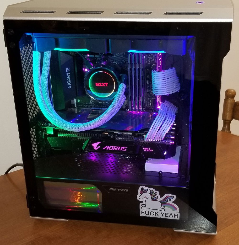 The sleeved PSU cables are from Corsair.  The PSU itself is wrapped in metallic rainbow film used in Cricut machines.
