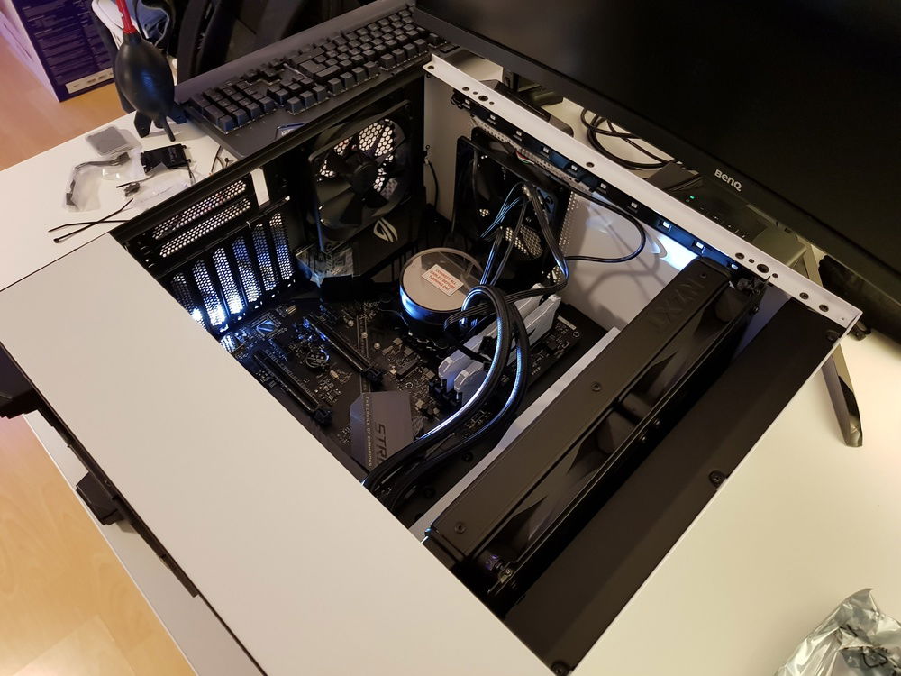Finally getting things into the case. It was a bit of a challenge in a mid-tower, but the cable management is second to none. I also mounted the tubing wrong, which was promptly corrected.