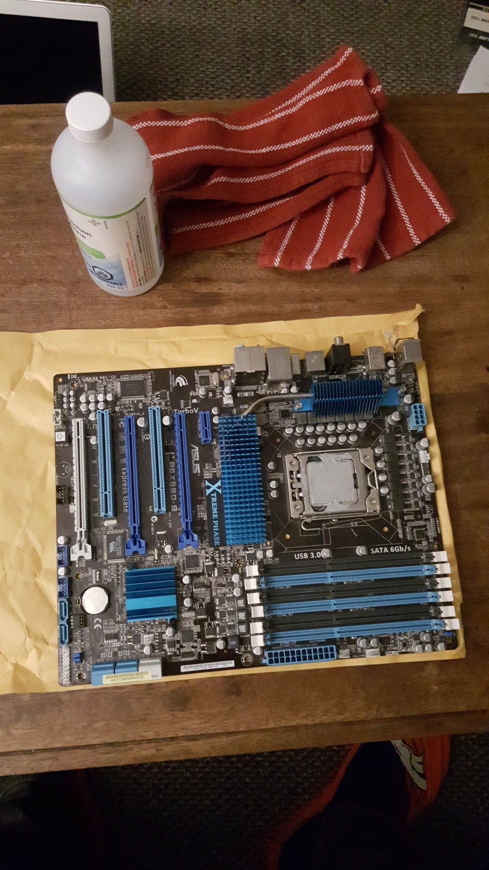 The thermal paste job of the guy I bought the mobo from...