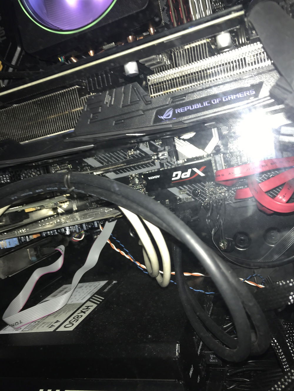 The visible NVMe drive is an 128GB Adata XPG SX6000, which is a 1.2 2x spec piece. It is working as a cache for the six Barracudas via Primocache. Hidden away behind the Vega 64 is a Western Digital Black 256GB NVMe 1.3 4x spec piece, which is where the Windows 10 installation resides.