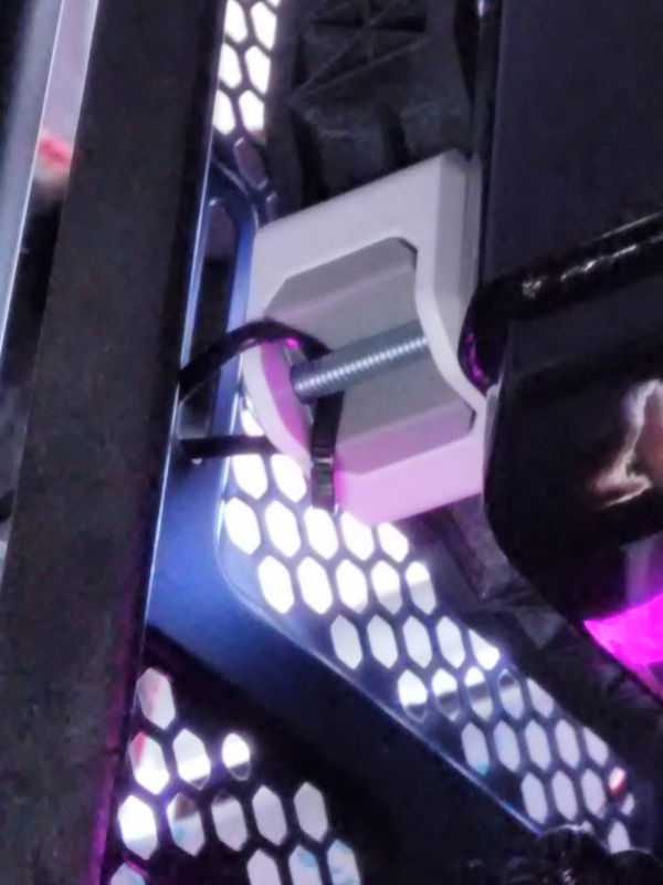 To hold the fan+radiator assembly to the chassis against the standoffs I made, I had to use a zip tie on every other corner as seen here. It's quite solid, I just think it's kind of silly what ends I had to go to for this to fit.
