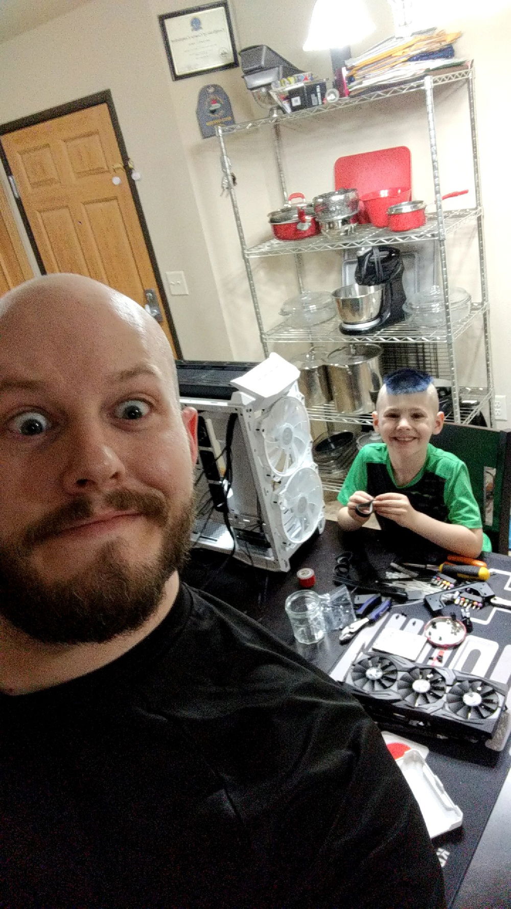 My son being taught how to build.