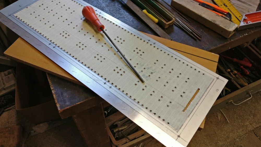 Another thing: A blind for the Triple-radiator. I started filing it out by hand...