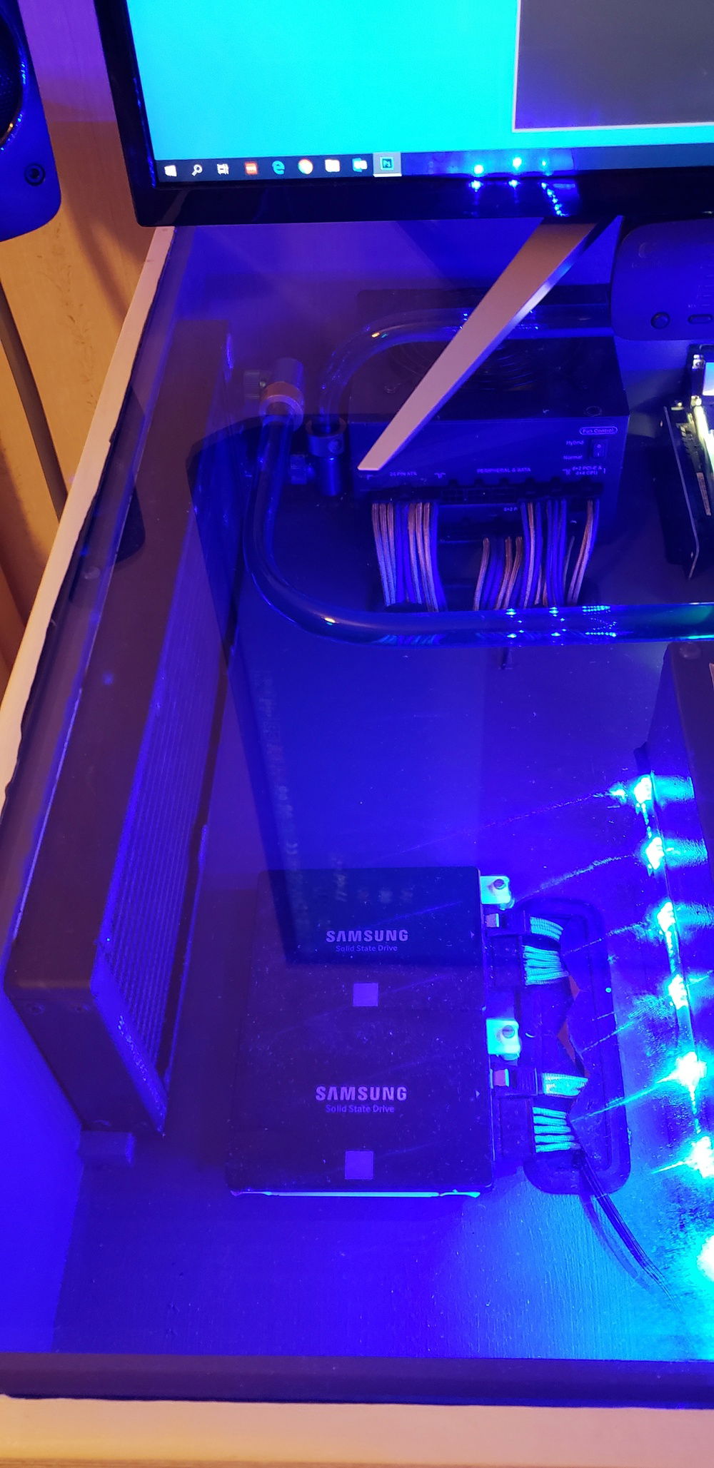 Left inside with storage, air intake through the EKWB radiator. The fans are recessed in the side of the desk.