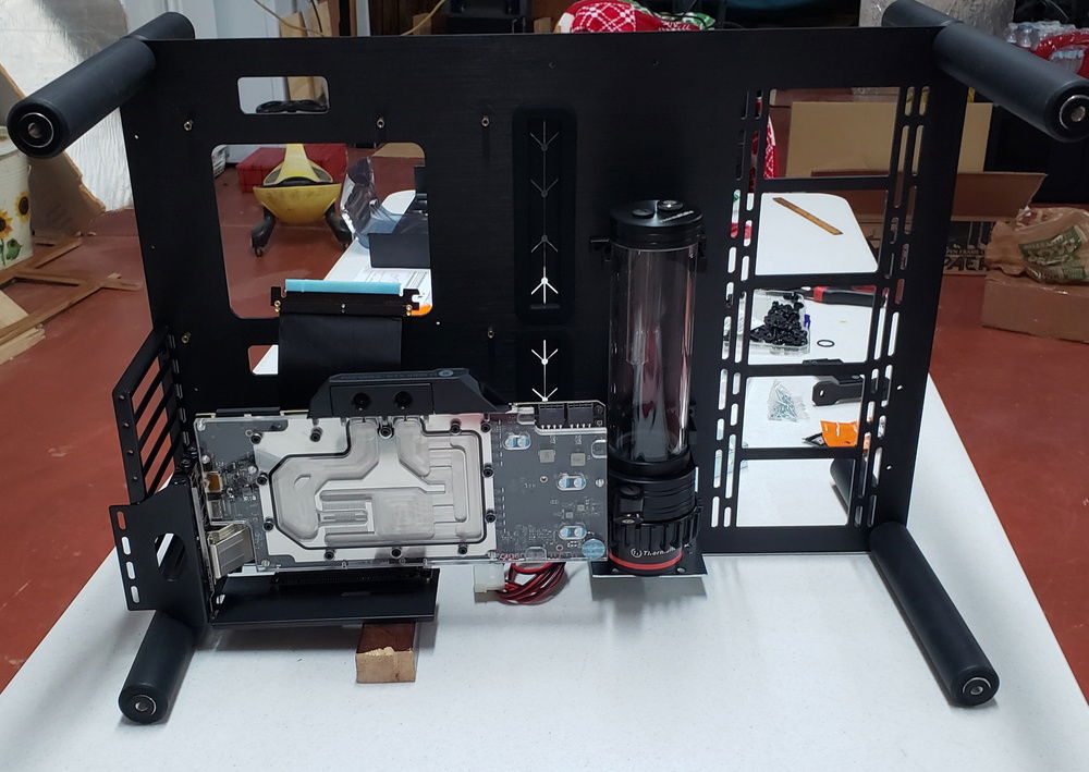 Testing ideas before the above fabricated mods were finalized. As you can see the GPU needed some additional support. Pictured is the Raijintek Vertical mount, ended up sending it back and going with the coolermaster mount, which had to be modded (of course)!