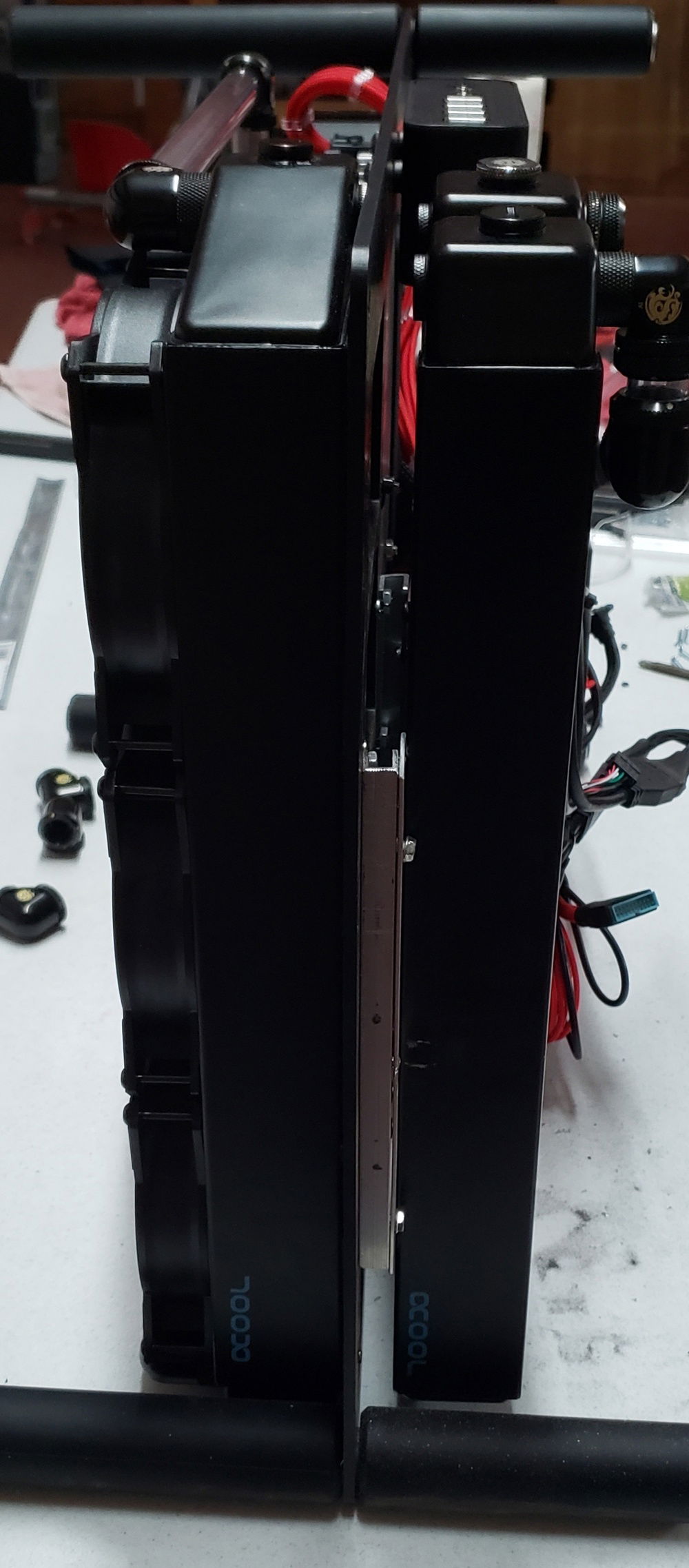 One radiator just didn't keep it as cool as we had thought. So a few weeks later we added another AlphaCool 45mm 360 to the back, not an Xflow this time. This required a substantial amount of modding and thinking outside of the box. This case is not designed to mount 2 radiators. We were able to fabricated a mount to the case and then the radiator to the mounting rails.