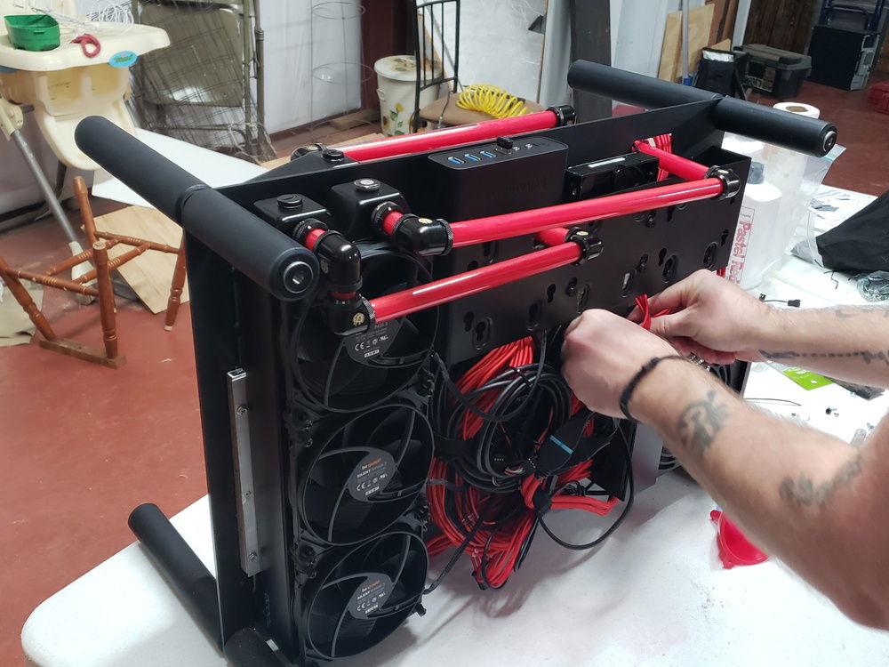 Hard to tell be we had to notch the SSD/HD bracket with the dremel so that we could run the tubing where we wanted.