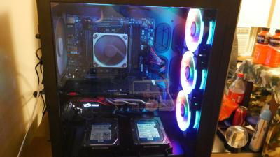 this is a side look inside the case showing the motherboard, cpu cooler ,ram and gpu with the hard driver sitting right under it.