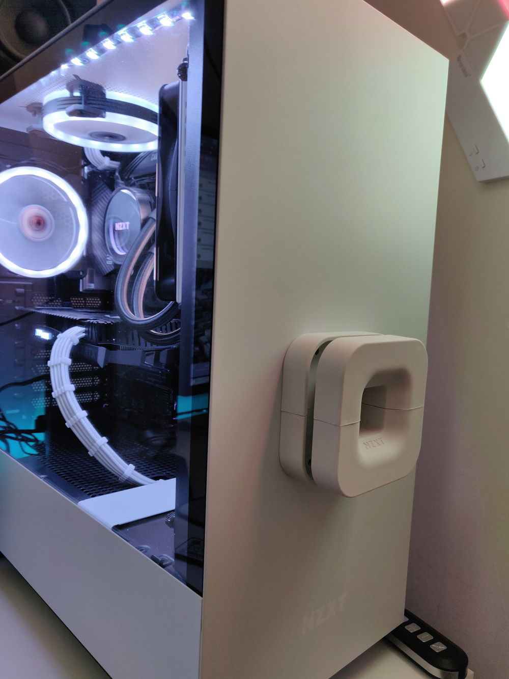 Replaced desk with white desk and added a NZXT Puck