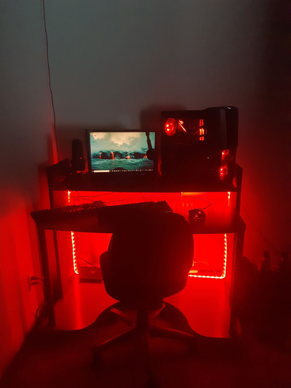 Full desk setup in the dark.