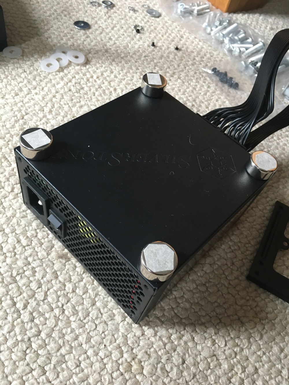 First step in modding the case: mounting the PSU flat to the case without a bracket...magnets (worked fine but wasn't the best solution).