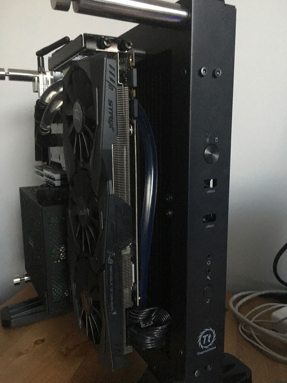 GPU back in and it is solid as a rock on those stainless standoffs. Just see a hint of radiator and tubing behind.