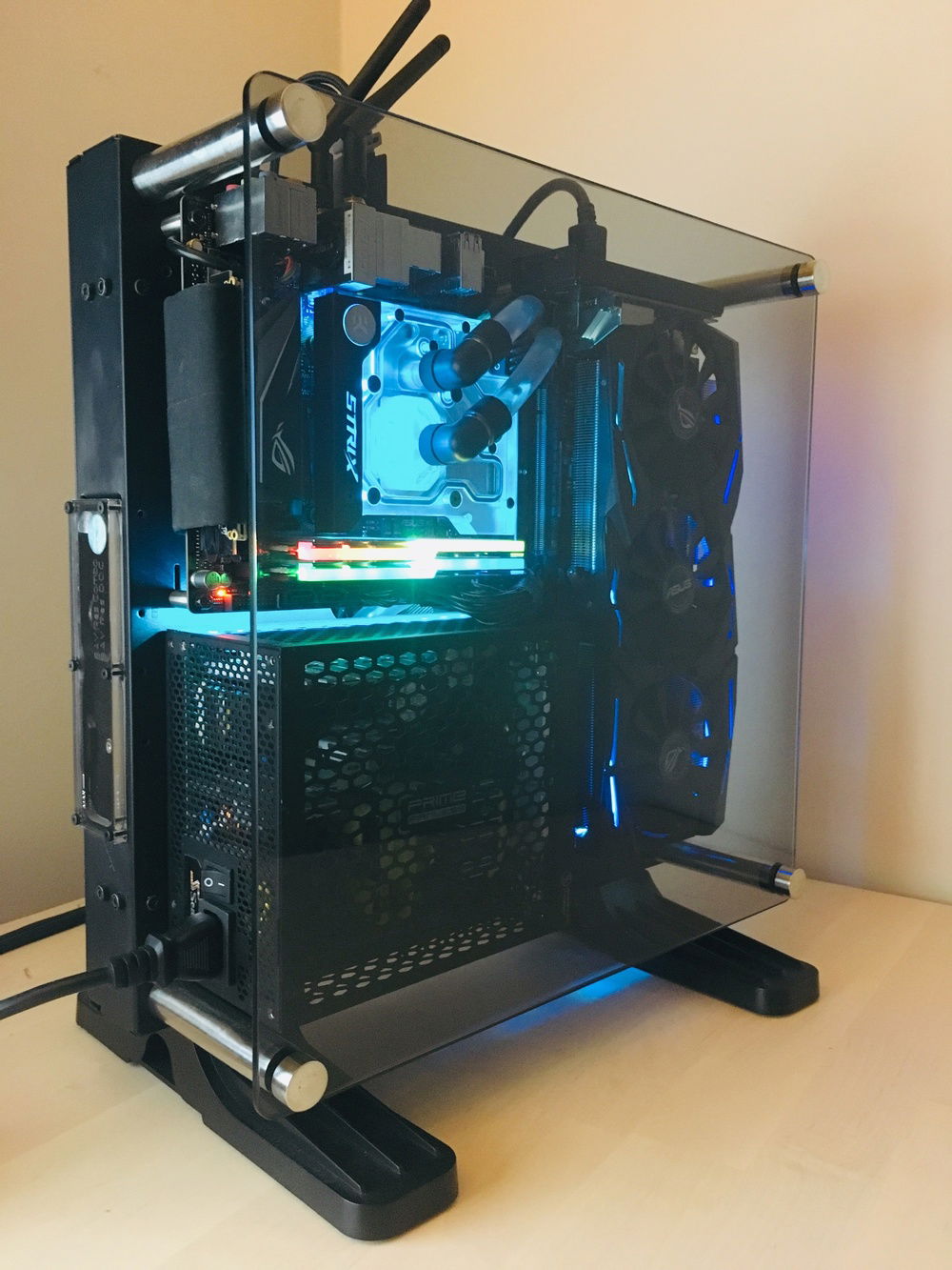 View of the other side. First view of the exterior face of the pump/reservoir combo unit. Can easily see the water level through the clear panel. Had to make a large hole in the side of the case to allow the unit to come through. Glass panel now on as well, sticker gone.