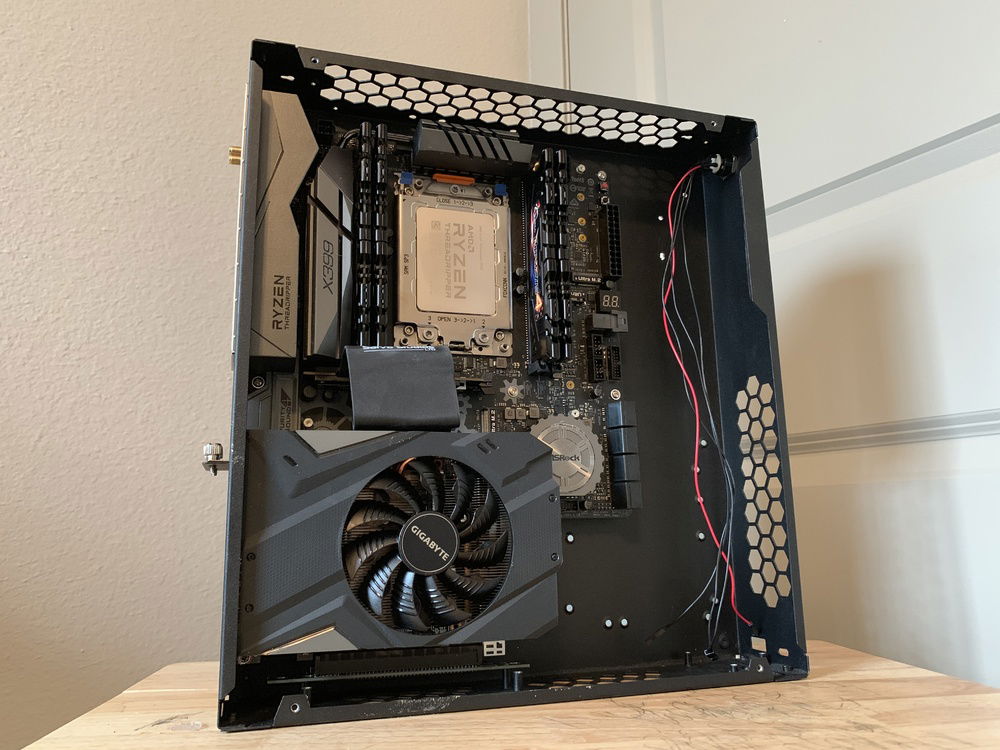 The AsRock X399M Taichi and the RTX 2060 fit like a glove. Some overlap but surprisingly no touching.