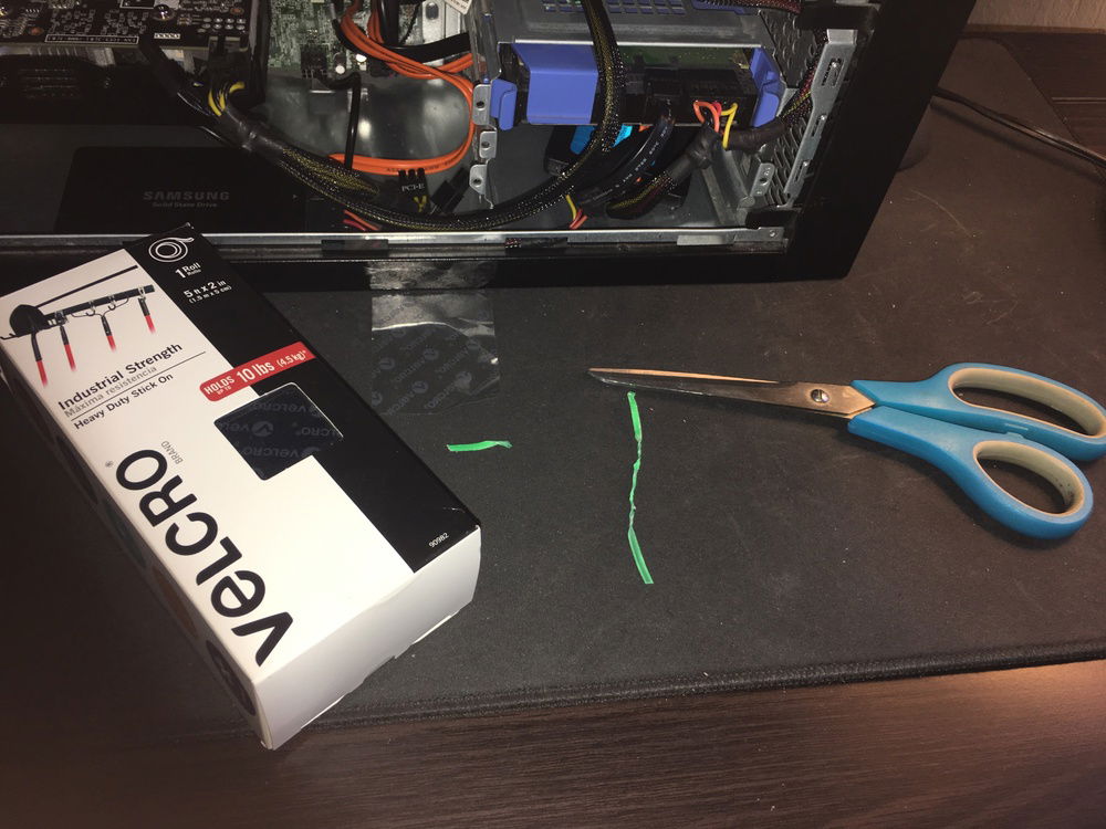 The stuff I used to clean up the case a little. 2 bread clips thingys and some velcro for the SSD